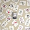Tennis playing cards with 54 legendary tennis players illustrated by hand.