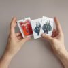 Formula 1 poker cards with illustrations of famous drivers like Hamilton and Verstappen.