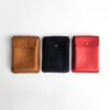 Brown, black and red leather playing cards cases, hand stitched.