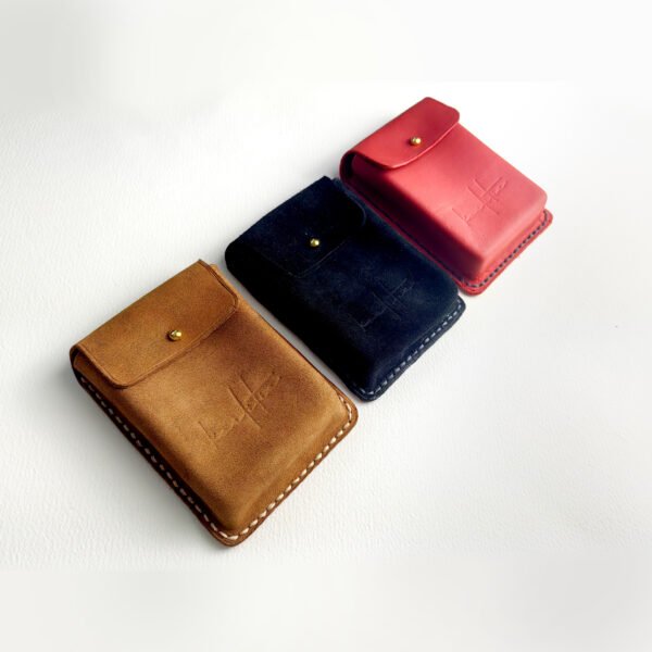 Hand stitched leather poker deck cases by Koalitia, in brown, black and red colors.