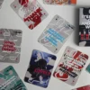 F1 Radio Messages Playing Cards deck spread on a table, showing illustrated iconic F1 quotes, standard poker size 63.5 x 88.8mm. "Simply Lovely" Verstappen quote card.