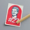 The Nico Hulkenberg portrait is shippied rolled and wrapped in acid-free black paper, tied with a red ribbon, ready to gift inside a sturdy cardboard mailing tube.